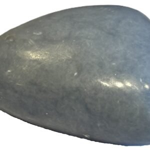 Smooth polished blue angelite carved heart crystal showing natural white mineral flecks on a white background